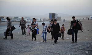 Thousands of Yazidi and Christian people flee to Erbil after the latest wave of Isis advances